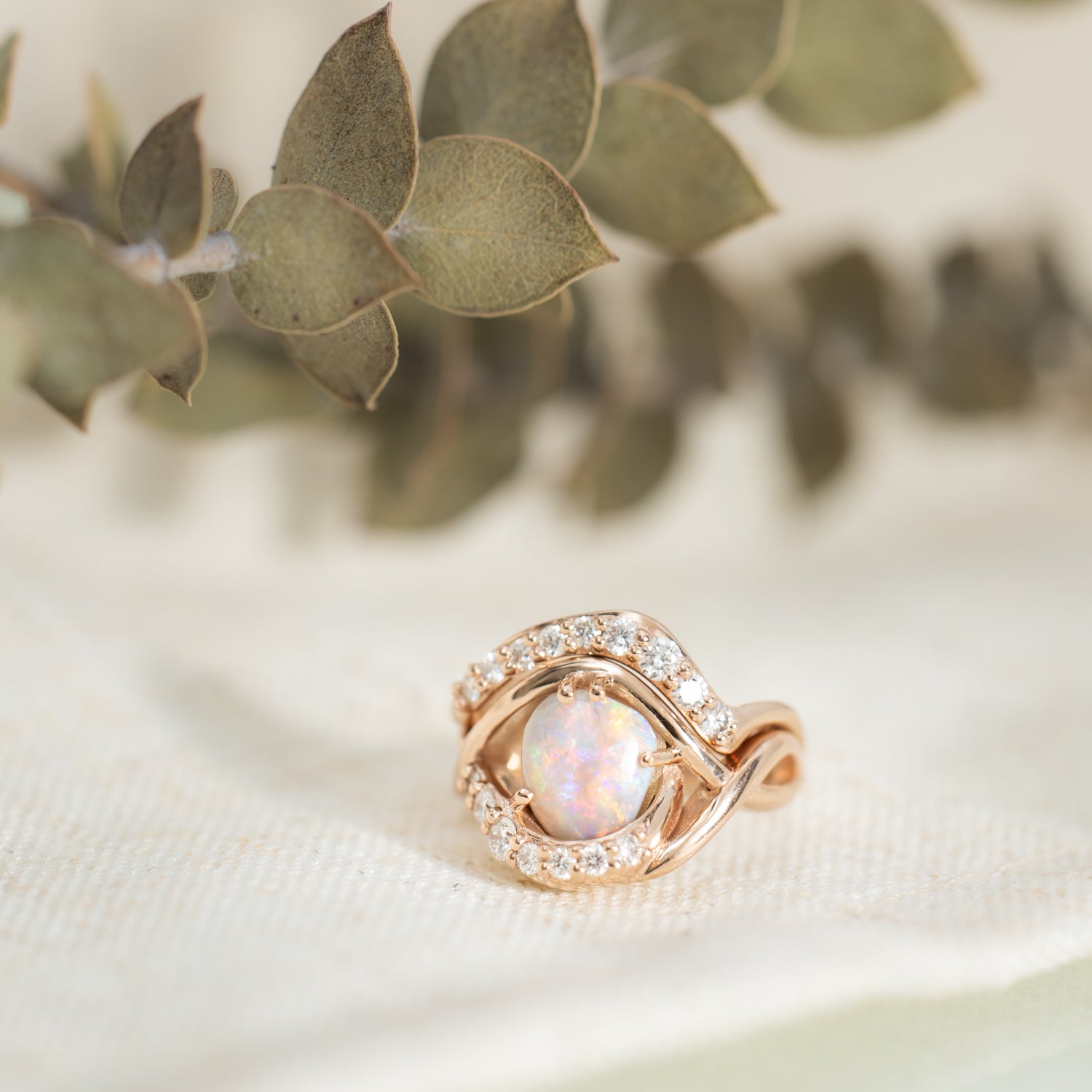 Nic Pearce - opal and diamond rose gold rings